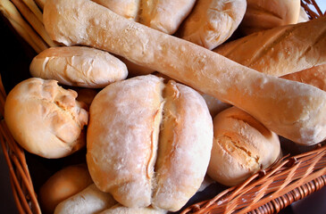 Italian food products, basket with some different wheat bread.