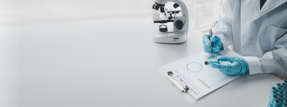 Chemist taking notes on research data, Scientist is working in the laboratory, Chemist is analyzing experimental results and taking notes in the laboratory, lab idea.