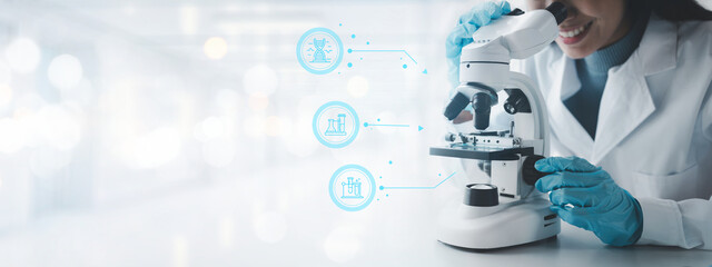 Fototapeta premium chemist is doing an experiment in the laboratory, A scientist is using a microscope to analyze the chemical composition, A scientific experiment is searching for biological answers in a laboratory.