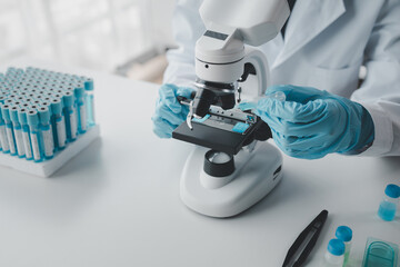 chemist is doing an experiment in the laboratory, A scientist is using a microscope to analyze the chemical composition, A scientific experiment is searching for biological answers in a laboratory.