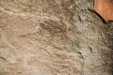 The texture of the stone is beige.Decorative stone or concrete. Rough texture.