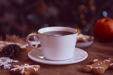 White coffee cup close up, template among handmade cookies