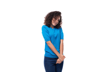 Fototapeta premium cute young curly brunette woman with shoulder-length hair is wearing a blue t-shirt