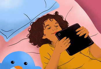 View from above happy girl laying, using digital tablet on bed at home
