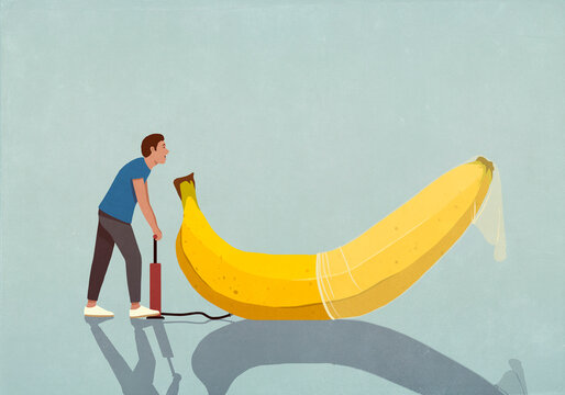 Man with bicycle pump inflating condom on banana
