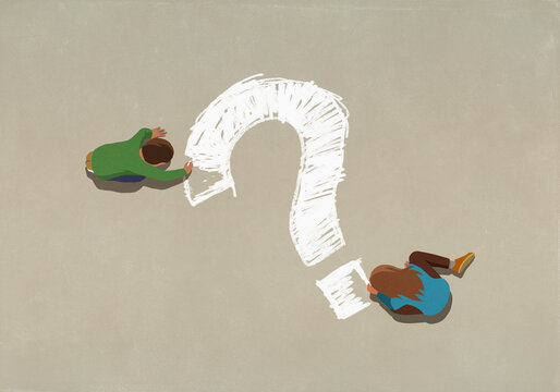 View from above boy and girl coloring question mark with chalk
