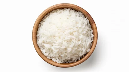 Foto op Canvas White rice in a wooden bowl © Riya