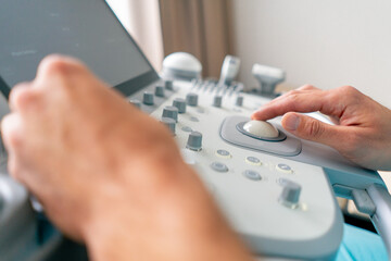 Close-up shot of an ultrasound diagnostic machine in medical center for scanning the state of the...
