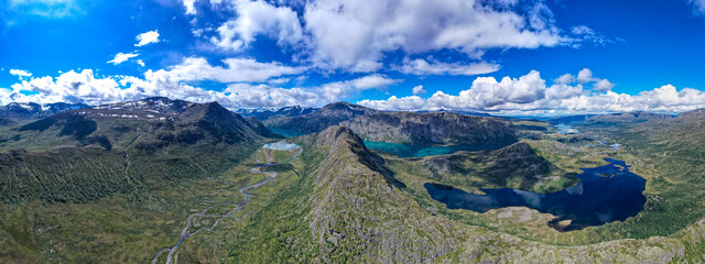 Fototapeta na wymiar Aerial view above Jotunheimen Norway - Glacier fed lakes in the highlands and valleys of Central Norway