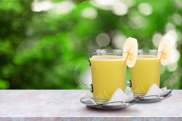 Cold tasty tea in cups on the desk