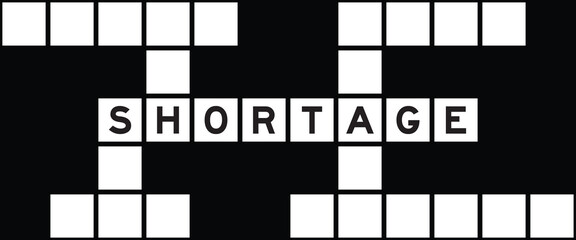 Alphabet letter in word shortage on crossword puzzle background - obrazy, fototapety, plakaty