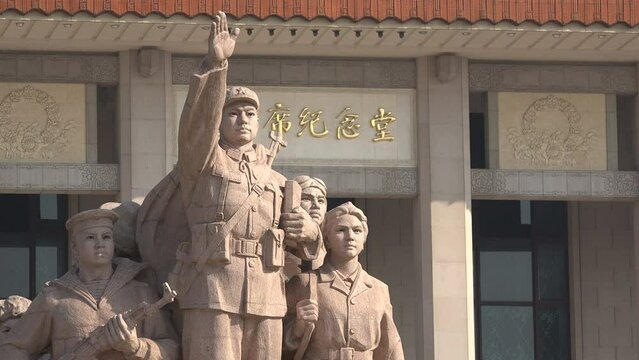 Communist inspired statue in front of the Mao Zedong mausoleum on Tiananmen Square in Beijing
