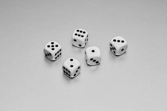 Still life five white and black dice on white background
