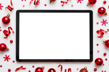 Christmas online shopping from home tablet pc with blank white display top view. Tablet with copy...