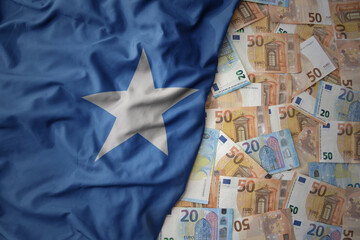 colorful waving national flag of somalia on a euro money background. finance concept