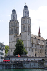 Naklejka premium Zurich, Switzerland. View of the historic city center with famous Grossmunster Cathedral with River Limmat.