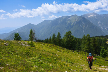 Fototapeta na wymiar Woman Hiking in Mountains, Velika Planina, Slovenia