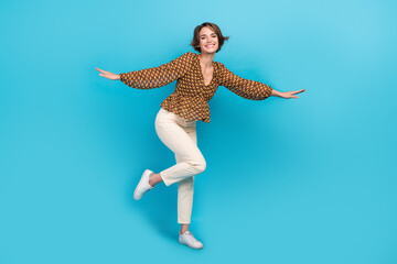 Full body photo of overjoyed cheerful lady good mood enjoy dancing partying isolated on blue color background