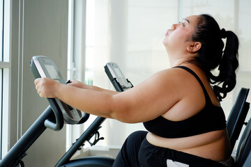 young woman exercising The concept of a plump woman losing weight.