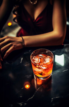 Generative AI illustration of anonymous woman in red dress gracefully holds a glowing cocktail on reflective black table with soft lights adding ambiance