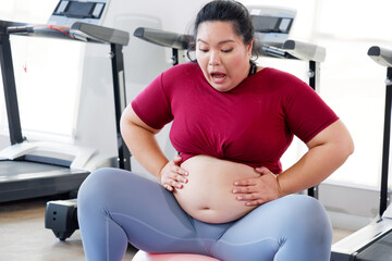 The belly of a plump girl Or a young woman with a belly fat.