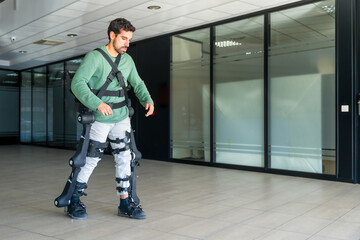 Mechanical exoskeleton, disabled person walking with the help of robotic skeleton, physiotherapy in a modern hospital, futuristic physiotherapy