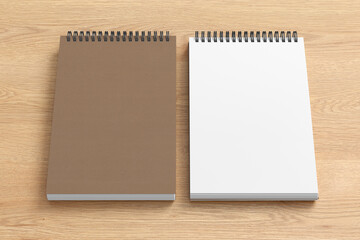 Notebook mockup. Closed and open blank notebook brown paper cover. Spiral notepad on wooden background