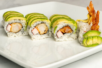 sushi roll with shrimp tempura, avocado and crab
