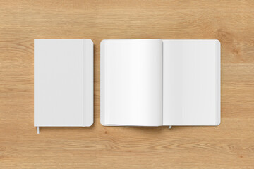 White cover notebook and opened notebook mockup on wooden background