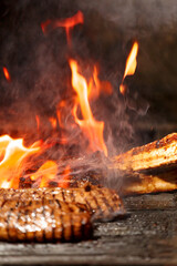 Juicy meat steaks and fillets are grilled