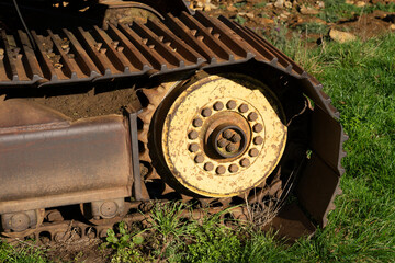 Close up of the drive wheel old rusty caterpillar track - 675323457