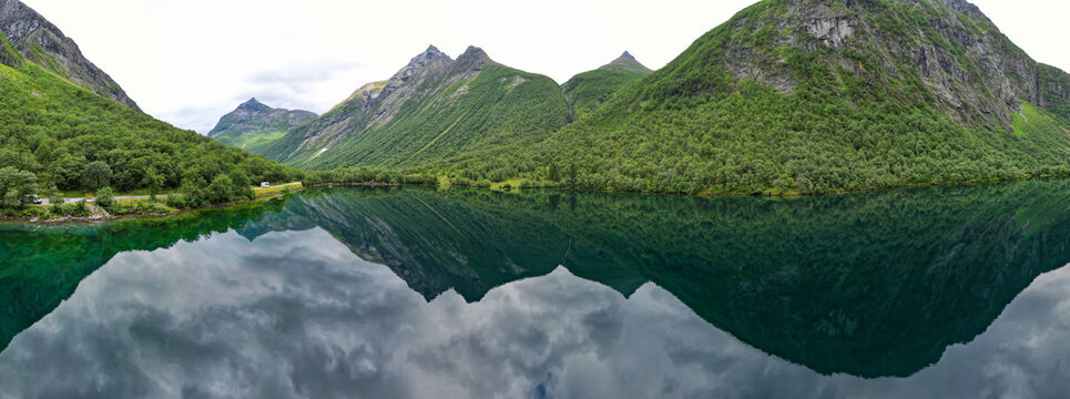 Aerial view of crystal clear reflection of the Fjords and mountains in Norway lake