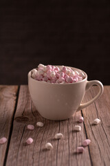 photo sweet dessert, lots of white and pink marshmallow in a cup, top view
