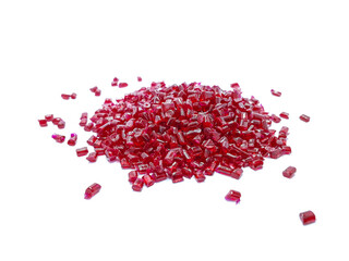 transparent red polycarbonate masterbatch granules isolated on a white background, this polymer is a colorant for products in the plastics industry