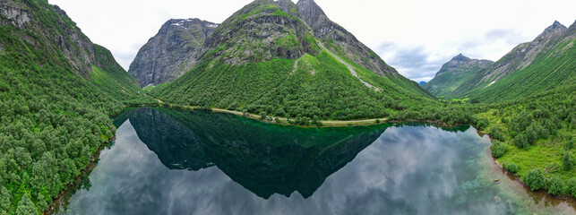 Aerial view of crystal clear reflection of the Fjords and mountains in Norway lake