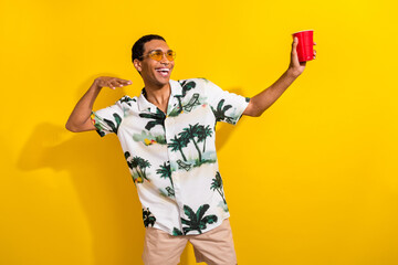 Photo portrait of nice young male dancing have fun disco paper cup dressed stylish palms print...