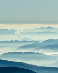 Mesmerizing view of the silhouetted landscapes covered in fog in Koralpe, Carinthia, Karnten,Austria