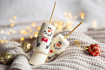 Two happy funny marshmallow snowmen, Christmas winter holiday decoration.