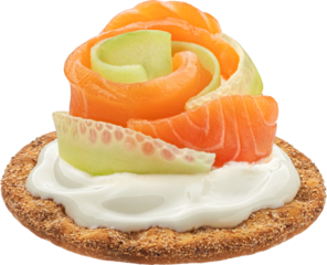 Smoked salmon with cream cheese on cracker isolated