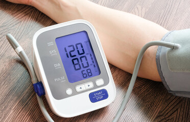 man check blood pressure monitor and heart rate monitor with digital pressure gauge. Health care...