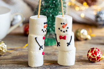 Snowmen made of marshmallows, cocoa drink, sweet treat for kids.