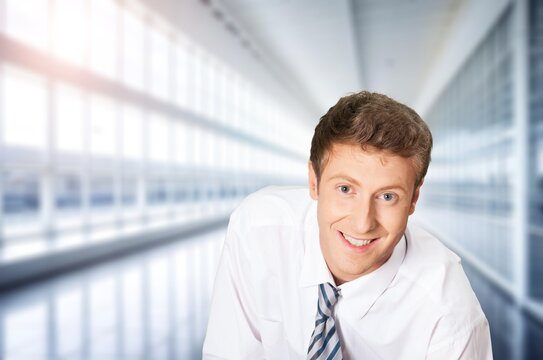 Happy business man standing in office, AI generated image