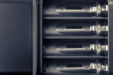 Battery compartment close-up. Battery charger.