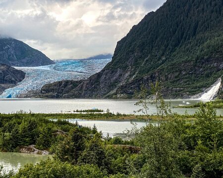 Mendenhall Glacier in Juneau, Alaska surrounded by majestic mountains