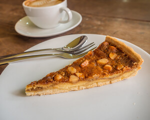 macadamia pie on a dish and coffee