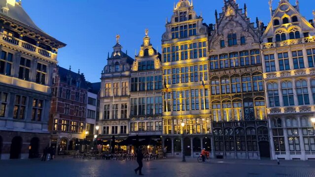 The Grote Markt of Antwerp, Belgium, beautiful old town square with evening lights, slow motion