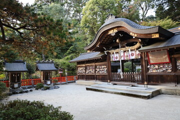 A Japanese shrine : the scene of subordinate shrines and Hon-den Main Hall in the precincts of...