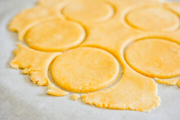 pastry-making with this captivating image featuring a close-up of perfectly cut shortcrust dough circles in a kitchen setting