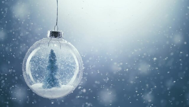 Christmas Tree inside snow ball swing in snow