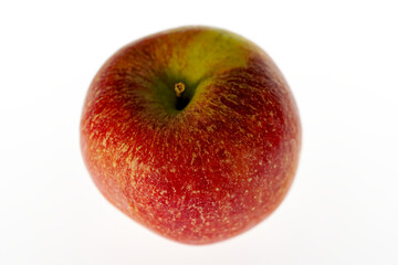 Close-up of ripe red and green apple against white illuminated background. Photo taken November 8th, 2023, Zurich, Switzerland.